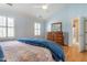 Spacious bedroom features hardwood floors, high ceilings and ensuite bathroom at 1809 Green Ford Ln, Apex, NC 27502