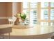 Dining table centerpiece featuring flowers, rabbit and candle in front of a window at 1809 Green Ford Ln, Apex, NC 27502