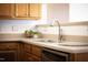 Well-lit kitchen featuring modern stainless steel appliances, double basin sink and updated countertops at 1809 Green Ford Ln, Apex, NC 27502