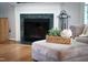Close-up of an ottoman in the living room, with a marble fireplace in the background at 1809 Green Ford Ln, Apex, NC 27502
