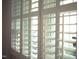 A close up view of white shutters covering a window, letting in natural light at 1809 Green Ford Ln, Apex, NC 27502