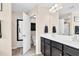 Large bathroom with double sinks, a full mirror, and an open doorway into the toilet and shower area at 1919 Sinclair Trce, Burlington, NC 27215