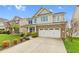 Beautiful two-story home with vinyl siding, brick accents, well-kept lawn and a two-car garage at 1919 Sinclair Trce, Burlington, NC 27215