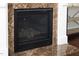 Close up of a fireplace with a marble surround and hearth at 1919 Sinclair Trce, Burlington, NC 27215