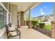 Front porch with welcome bench, brick columns and nice landscaping at 1919 Sinclair Trce, Burlington, NC 27215
