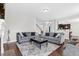 Spacious living room with hardwood floors, grey sofas, and lots of natural light at 1919 Sinclair Trce, Burlington, NC 27215