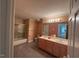 Bathroom featuring a double sink vanity and shower with glass door at 208 E Jules Verne Way, Cary, NC 27511