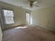 Bedroom featuring large windows for ample natural light at 208 E Jules Verne Way, Cary, NC 27511