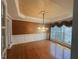 Dining room boasting hardwood floors, chandelier, and ornate ceiling design at 208 E Jules Verne Way, Cary, NC 27511