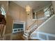 Grand foyer featuring staircase, chandelier, and elegant trim details at 208 E Jules Verne Way, Cary, NC 27511