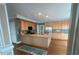 Kitchen with wood cabinets, center island, and stainless steel refrigerator at 208 E Jules Verne Way, Cary, NC 27511