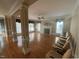 Spacious living room with hardwood floors, fireplace, and large windows at 208 E Jules Verne Way, Cary, NC 27511