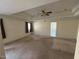 Large main bedroom featuring a ceiling fan and tray ceiling detail at 208 E Jules Verne Way, Cary, NC 27511