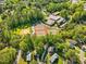 Scenic aerial view of the community with lush greenery, showcasing nearby schools and amenities at 209 Dickens Dr, Raleigh, NC 27610