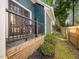 Inviting back porch with a railing, offering a relaxing outdoor space with garden views at 209 Dickens Dr, Raleigh, NC 27610