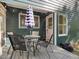 Cozy back porch featuring outdoor seating and string lights, perfect for relaxing evenings at 209 Dickens Dr, Raleigh, NC 27610