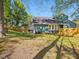 Lush backyard with a patio area, ideal for outdoor dining and entertaining guests at 209 Dickens Dr, Raleigh, NC 27610