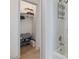 This bathroom boasts convenient storage with a closet featuring shelving at 209 Dickens Dr, Raleigh, NC 27610