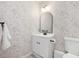 Elegant bathroom with floral wallpaper and black hardware at 209 Dickens Dr, Raleigh, NC 27610