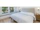 Bright bedroom with a window seat overlooking mature trees, featuring a neutral color palette at 209 Dickens Dr, Raleigh, NC 27610
