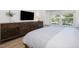 Bedroom featuring a large dresser, window seat, and serene outdoor views at 209 Dickens Dr, Raleigh, NC 27610