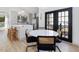 Bright dining area featuring modern lighting fixtures and a stylish kitchen backdrop at 209 Dickens Dr, Raleigh, NC 27610