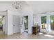 Inviting entryway featuring light wood floors, a console table with lamps, and natural light at 209 Dickens Dr, Raleigh, NC 27610