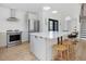 Modern kitchen island featuring a white countertop, stainless steel appliances, and seating at 209 Dickens Dr, Raleigh, NC 27610