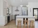 Modern kitchen with stainless steel appliances, a center island, and stylish bar stools at 209 Dickens Dr, Raleigh, NC 27610