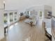 Bright, open-concept living room with modern furnishings, large windows, and a sleek, airy design at 209 Dickens Dr, Raleigh, NC 27610