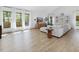Bright, open living area with wood floors, white walls, comfortable seating and lots of natural light at 209 Dickens Dr, Raleigh, NC 27610