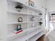 Contemporary shelving unit displaying decorative items in a well-lit living room at 209 Dickens Dr, Raleigh, NC 27610