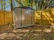 Durable metal storage shed in the backyard, perfect for organizing tools and outdoor equipment at 209 Dickens Dr, Raleigh, NC 27610