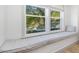 Inviting window seat with tree views, perfect for relaxing and enjoying natural light at 209 Dickens Dr, Raleigh, NC 27610