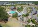 Aerial view showcasing the community pool, playground, and clubhouse, highlighting the recreational amenities at 240 Liberty Star Rd, Wendell, NC 27591