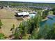 Aerial shot of the community featuring a lake, pool, clubhouse, and playground, showcasing the community amenities at 240 Liberty Star Rd, Wendell, NC 27591