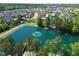 Aerial view of community featuring a pond, fountain, landscaping, and neighborhood homes at 240 Liberty Star Rd, Wendell, NC 27591