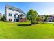 Spacious backyard with green grass, screened-in porch, and privacy fence at 240 Liberty Star Rd, Wendell, NC 27591