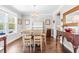 Elegant dining room with hardwood floors, white wainscoting, and a stylish chandelier above the dining table at 240 Liberty Star Rd, Wendell, NC 27591