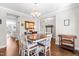Spacious dining room with hardwood floors, a modern chandelier, and an open layout that flows into other living areas at 240 Liberty Star Rd, Wendell, NC 27591