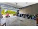 Organized garage with open door, ample storage and workspace; showcasing a clutter-free and functional area at 240 Liberty Star Rd, Wendell, NC 27591