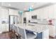 Well-appointed kitchen with a large island, granite countertops, stylish pendant lighting, and ample seating at 240 Liberty Star Rd, Wendell, NC 27591