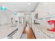 Gourmet kitchen featuring white cabinetry, granite counters, stainless steel appliances and a central island with a sink at 240 Liberty Star Rd, Wendell, NC 27591