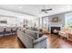 Comfortable living room with fireplace, plush sofa, hardwood floors, and view to kitchen at 240 Liberty Star Rd, Wendell, NC 27591