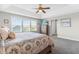 Spacious main bedroom with a ceiling fan, television, and large windows for natural light at 240 Liberty Star Rd, Wendell, NC 27591