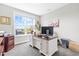 Bright office space features a large window, neutral walls, and a modern desk setup at 240 Liberty Star Rd, Wendell, NC 27591