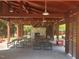 Outdoor pavilion featuring picnic tables and a stone fireplace, ideal for community gatherings and events at 240 Liberty Star Rd, Wendell, NC 27591