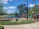 Community playground area with swings and climbing structures, perfect for entertainment and activities at 240 Liberty Star Rd, Wendell, NC 27591