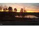 Scenic sunset view overlooking a tranquil pond with reflections of trees at 240 Liberty Star Rd, Wendell, NC 27591
