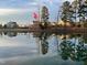 Scenic view of houses reflecting on a pond surrounded by trees at 240 Liberty Star Rd, Wendell, NC 27591